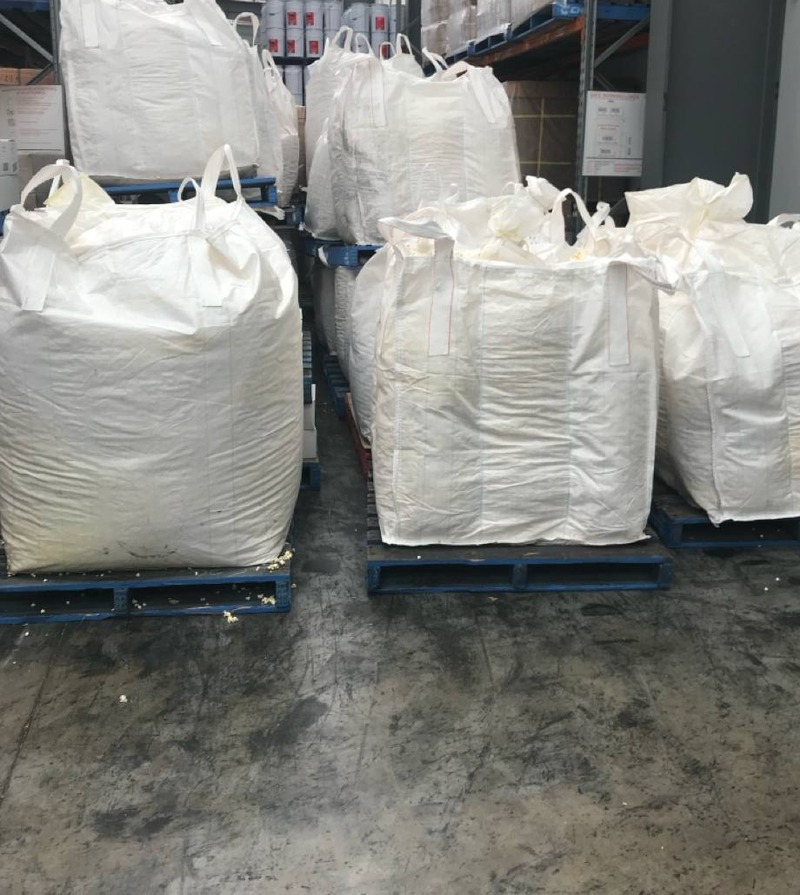 1 tonne bulk bags of corn screenings on pallets at Hay Stock Feed warehouse